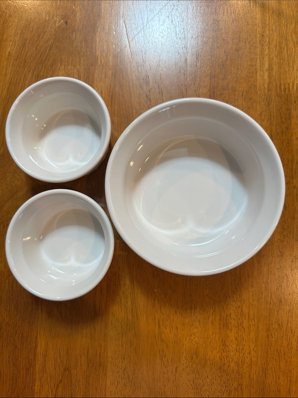 Corningware French White stone ware. 2-4 oz. And 1-16 oz.